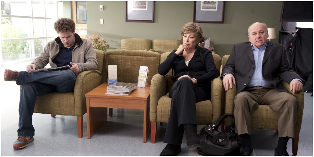 Three People Waiting In A Waiting Room