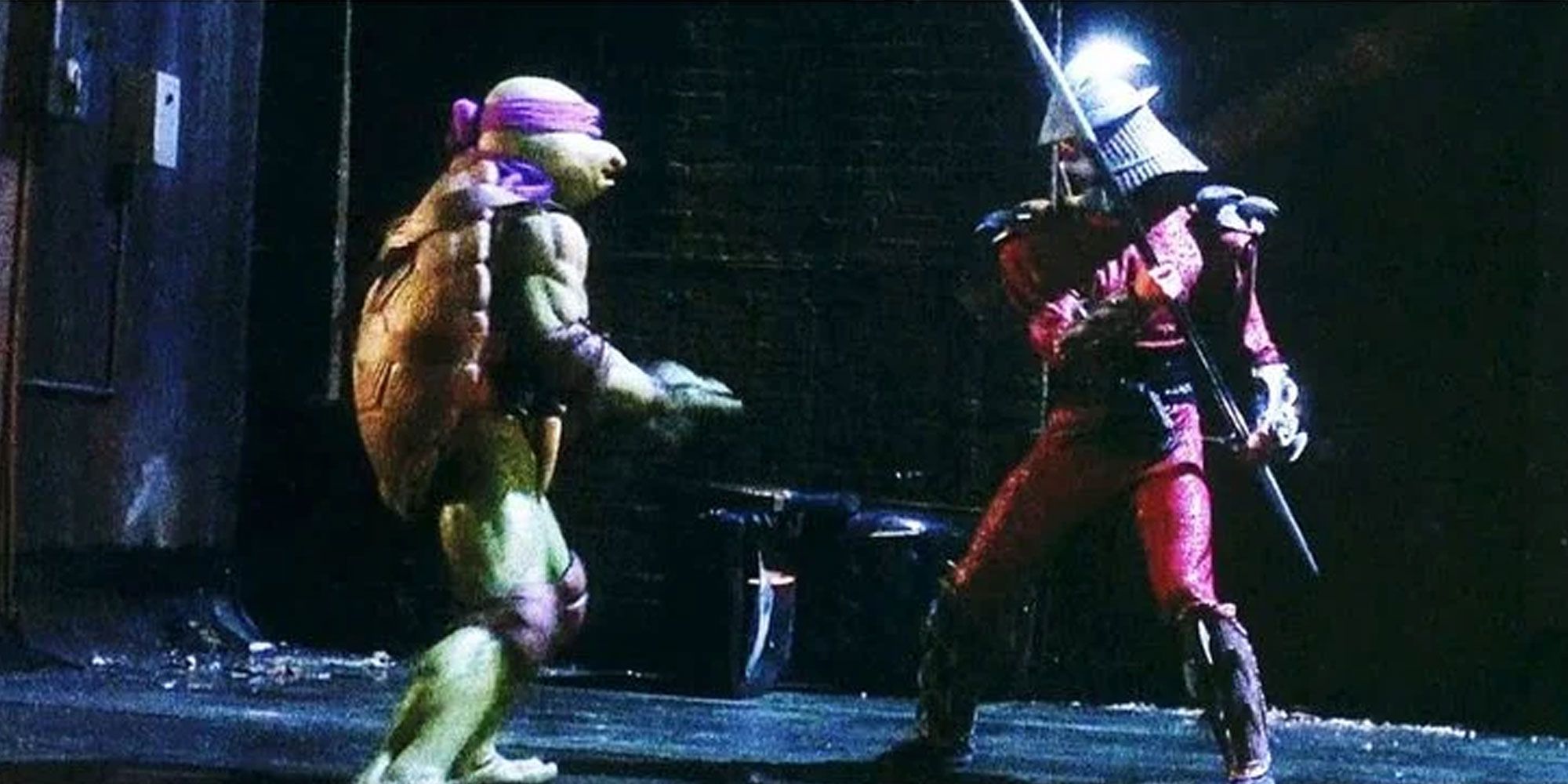 Donatello fights Shredder in the 90s Teenage Mutant Ninja Turtles live action movie