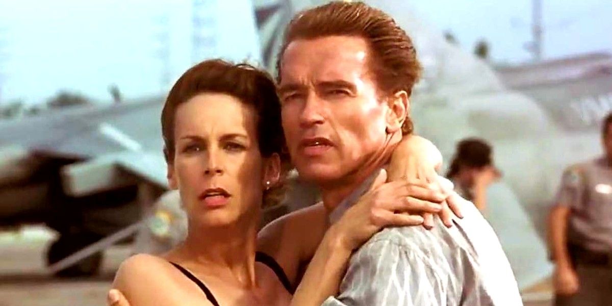 Arnold Schwarzenegger and Jamie Lee Curtis embracing in True Lies