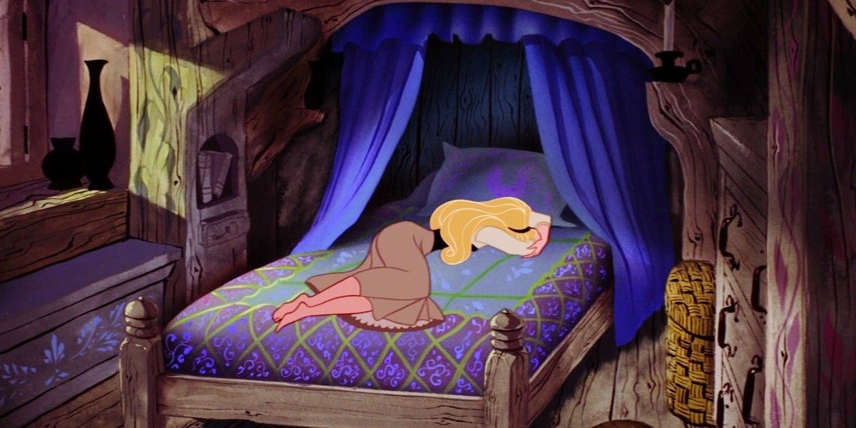 Aurora on her bed in Sleeping Beauty