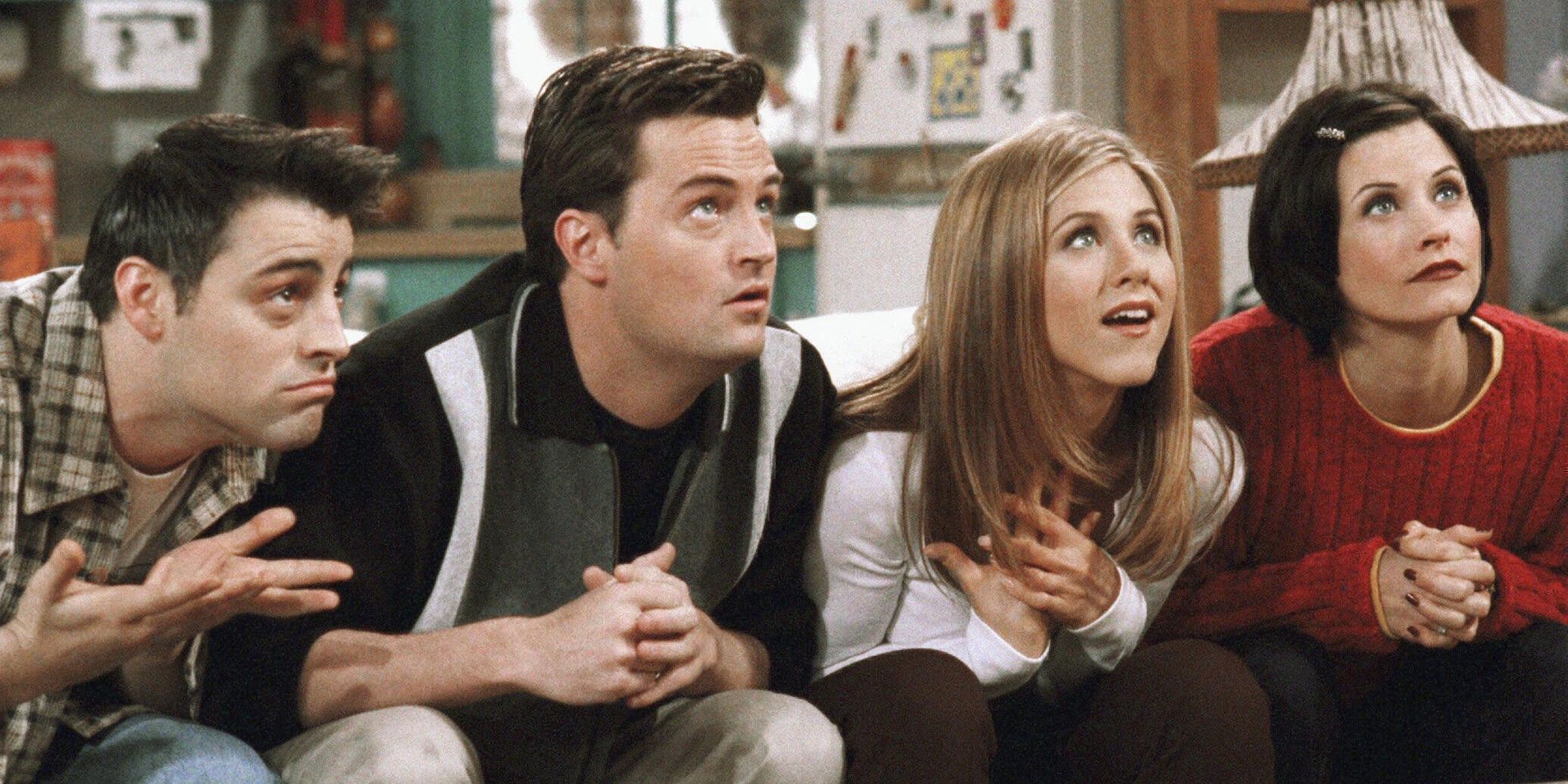 Joey, Chandler, Rachel and Monica play trivia on the sofa