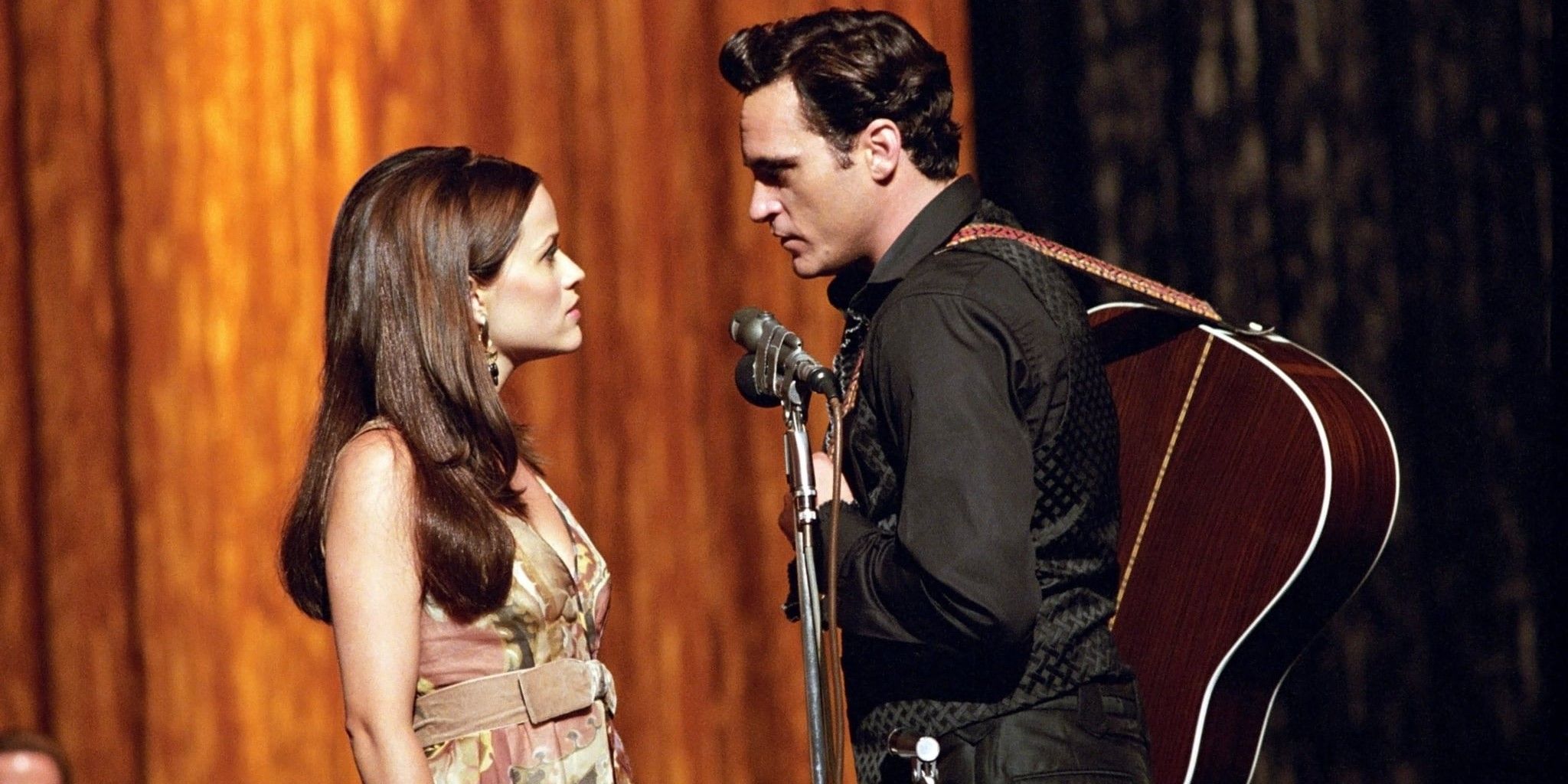 June and Johnny look at each other on stage in Walk the Line