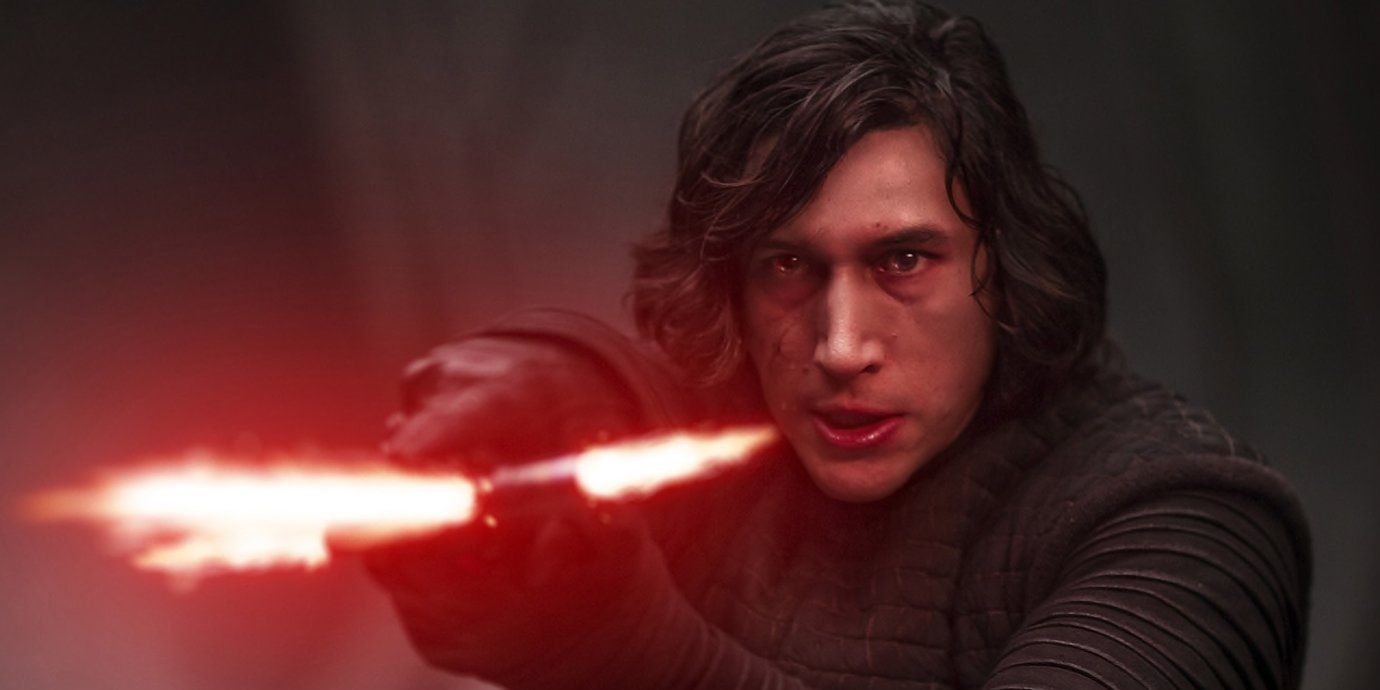 Kylo Ren aims his red lightsaber in The Last Jedi.