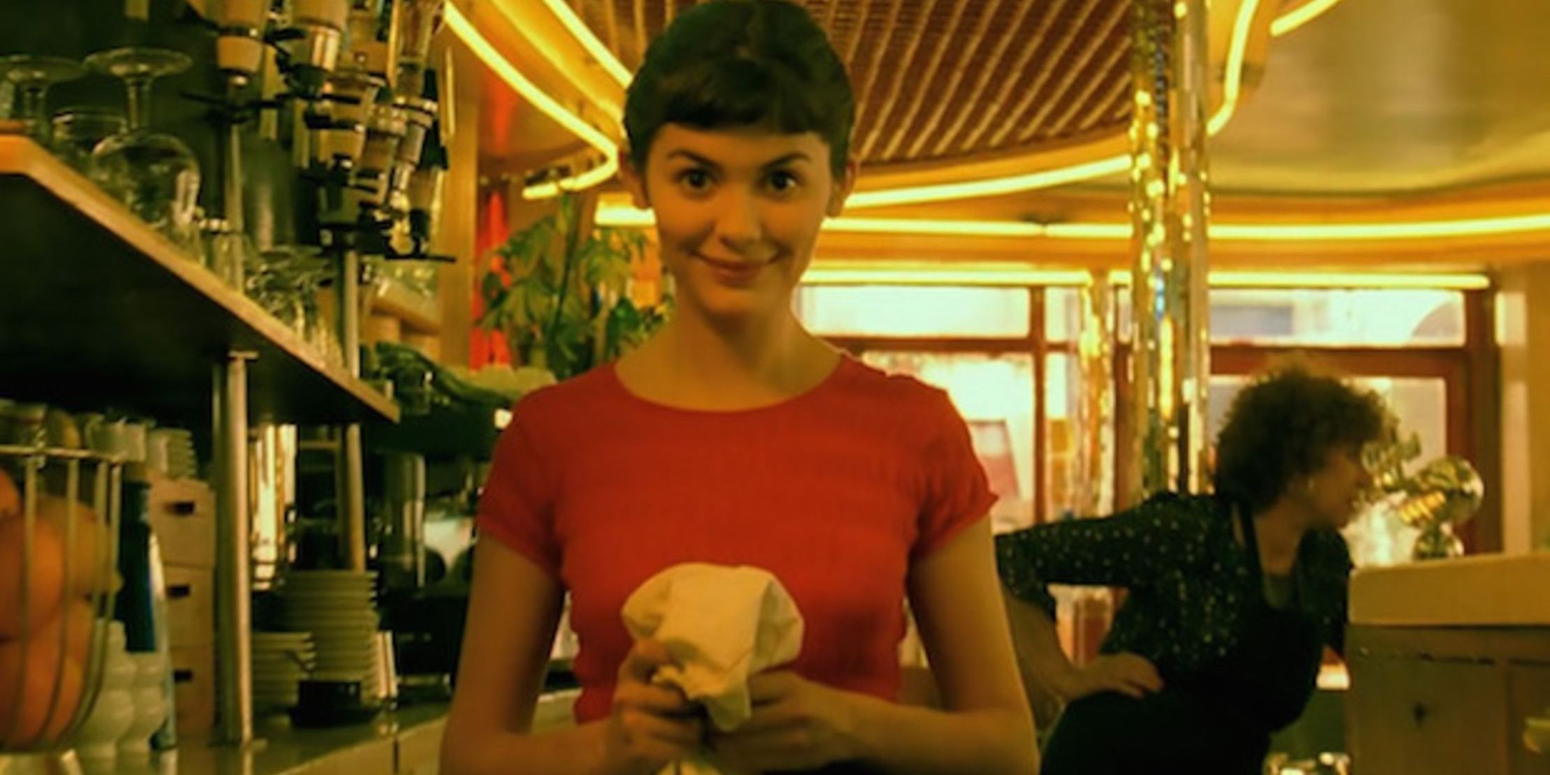 Scene from Amelie with Amlie smiling in the cafe.