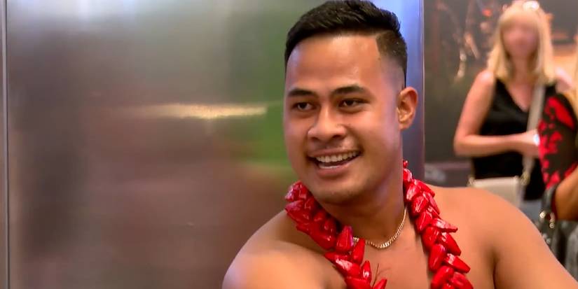 Asuelu Pulaa In 90 Day Fiance dancing in traditional costume and smiling at airport