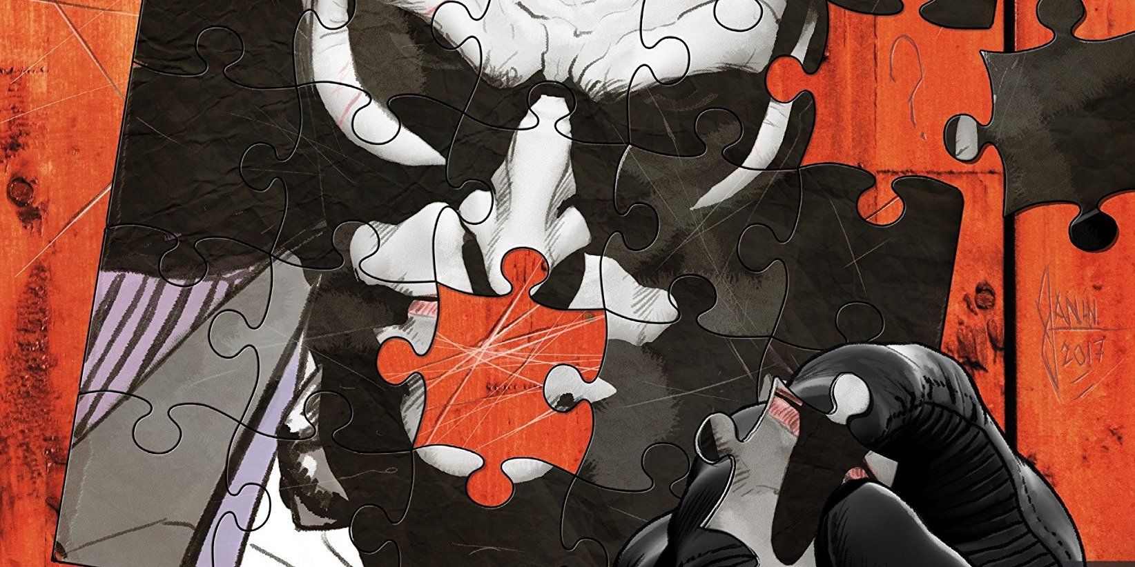 Batman's fingers holding a puzzle piece over an unfinished jigsaw puzzle of The Joker's face on a cover of The War of Jokes and Riddles comic series.