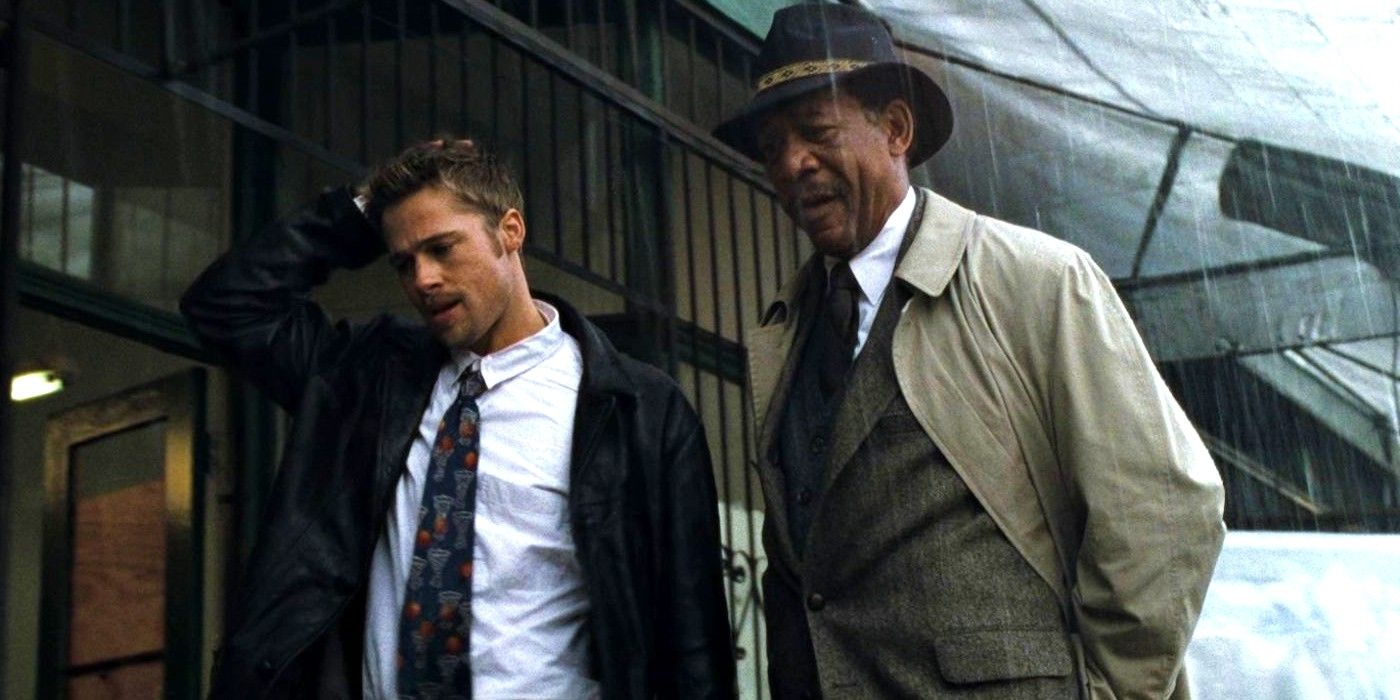 Brad Pitt and Morgan Freeman standing in the rain in Se7en