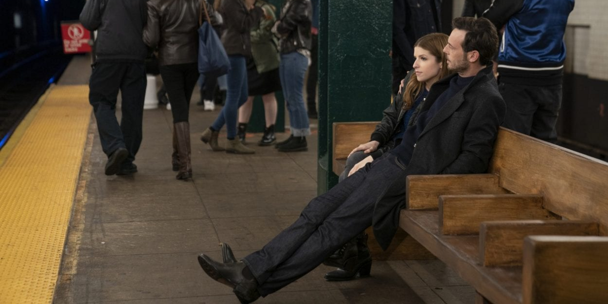 Darby and Bradley sit on a subway bench