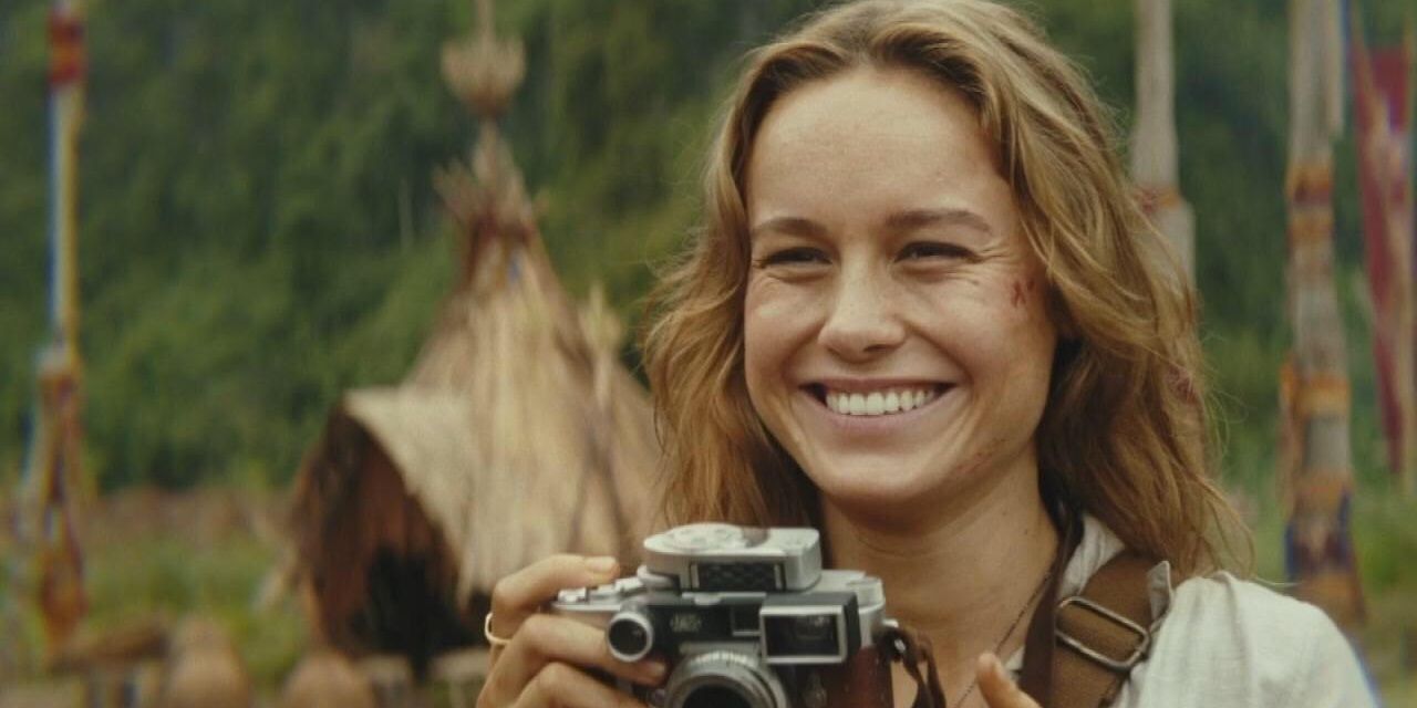 Brie Larson holding camera in Kong Skull Island