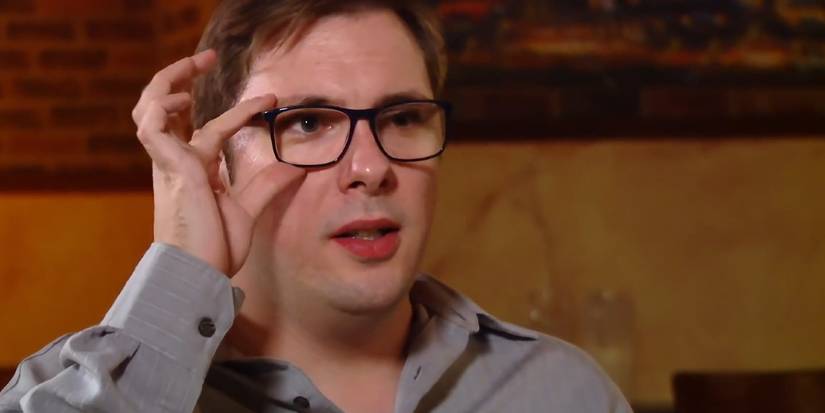 Colt Johnson In 90 Day Fiance clean shaved and playing with his glasses