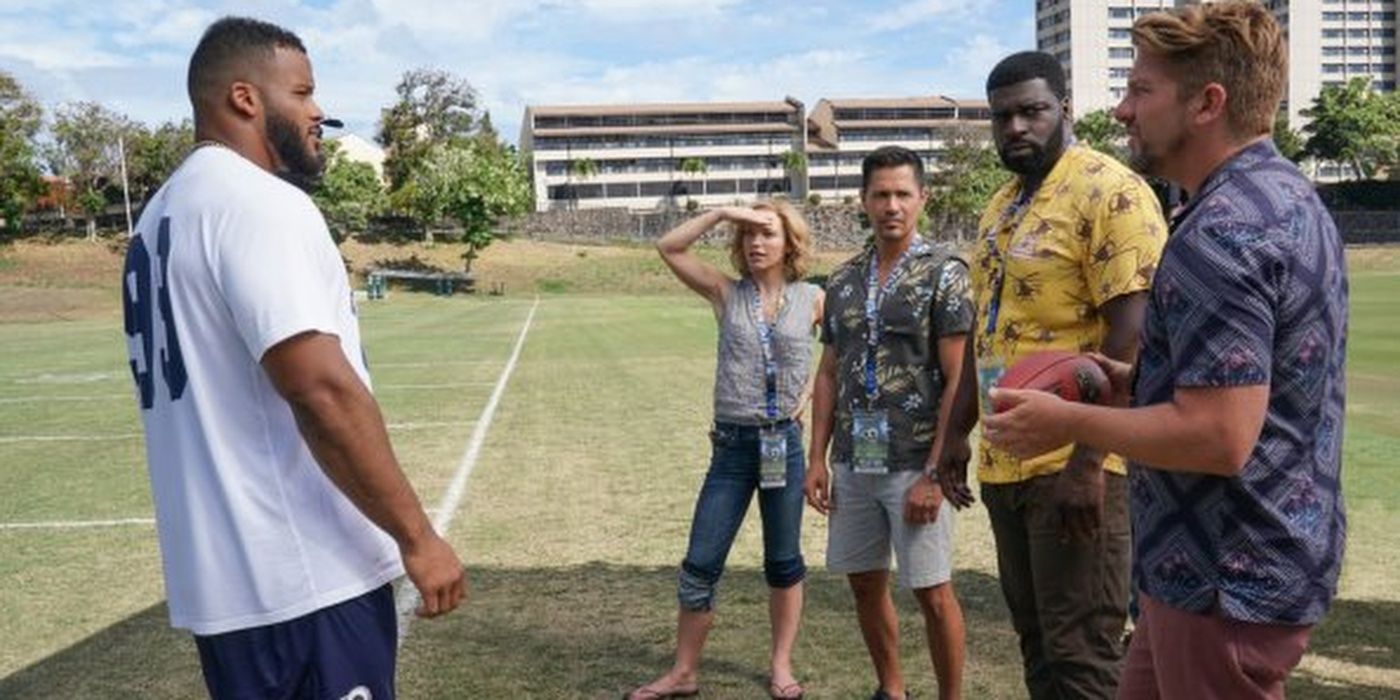 Higgins, Magnum, T.C. and Rick with Aaron Donald on a field in Magnum PI