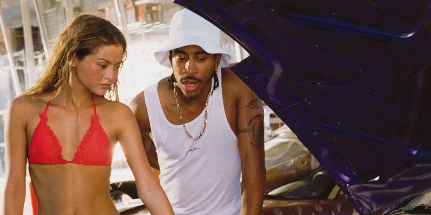 Devon Aoki and Ludacris check out an engine in 2 Fast 2 Furious