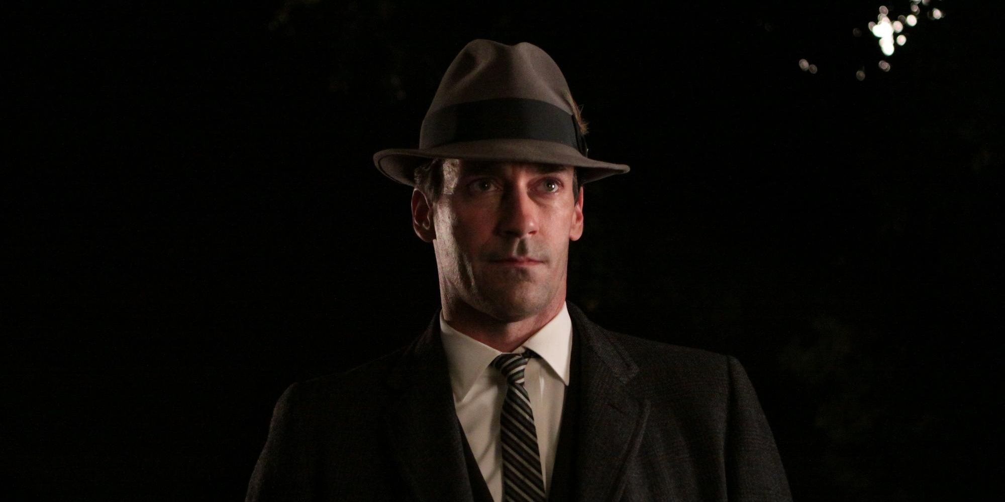 Don Draper in a suit and hat