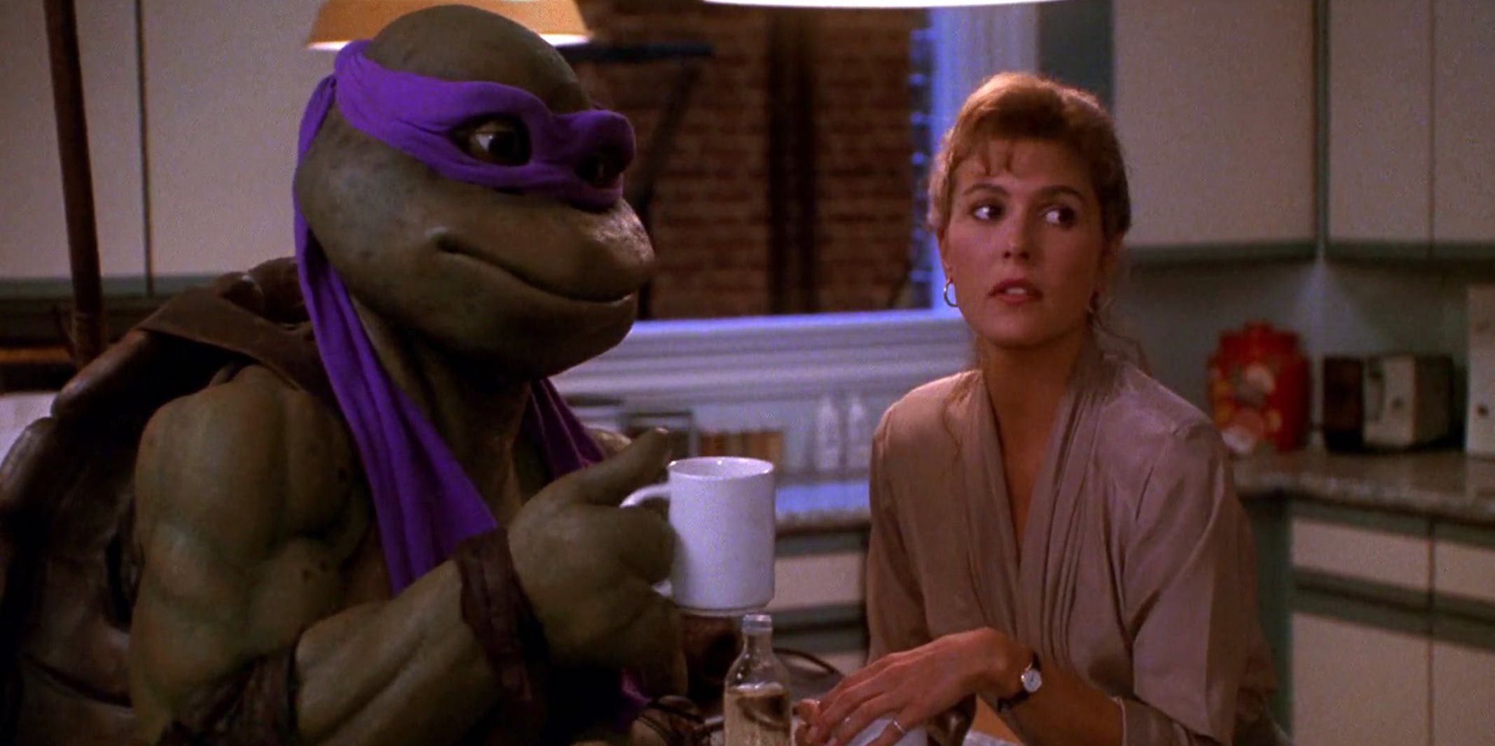 Donatello and April in her kitchen in Teenage Mutant Ninja Turtles The Secret Of The Ooze
