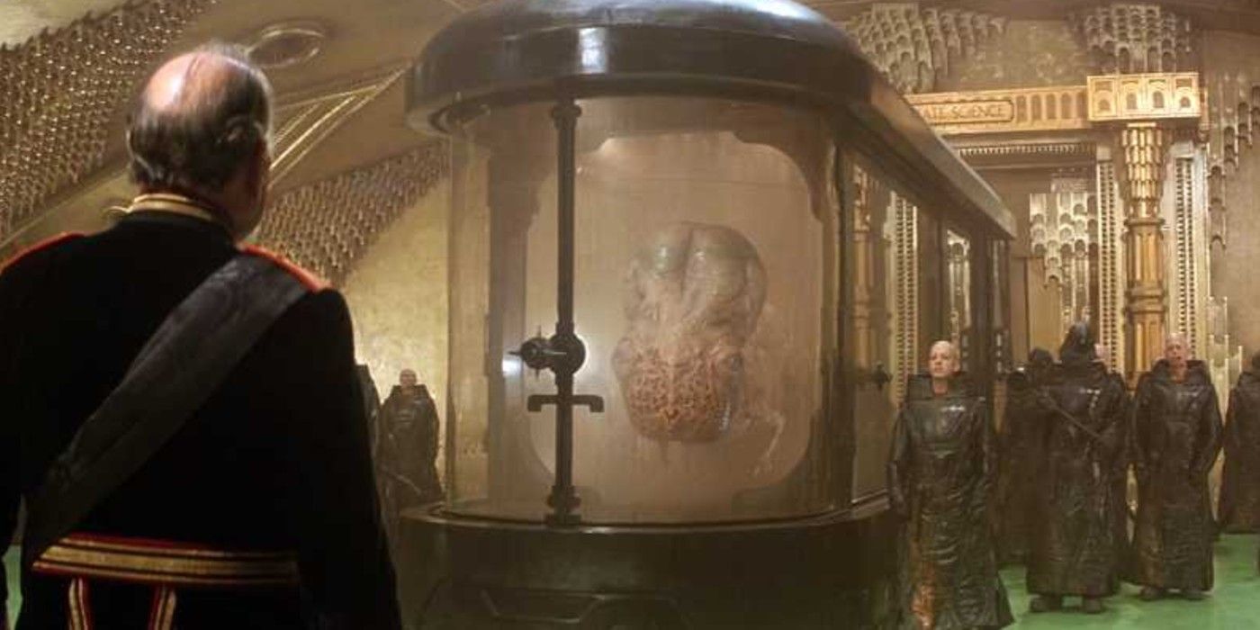 A Guild Navigator in a tank speaks with the Emperor in Dune (1984)