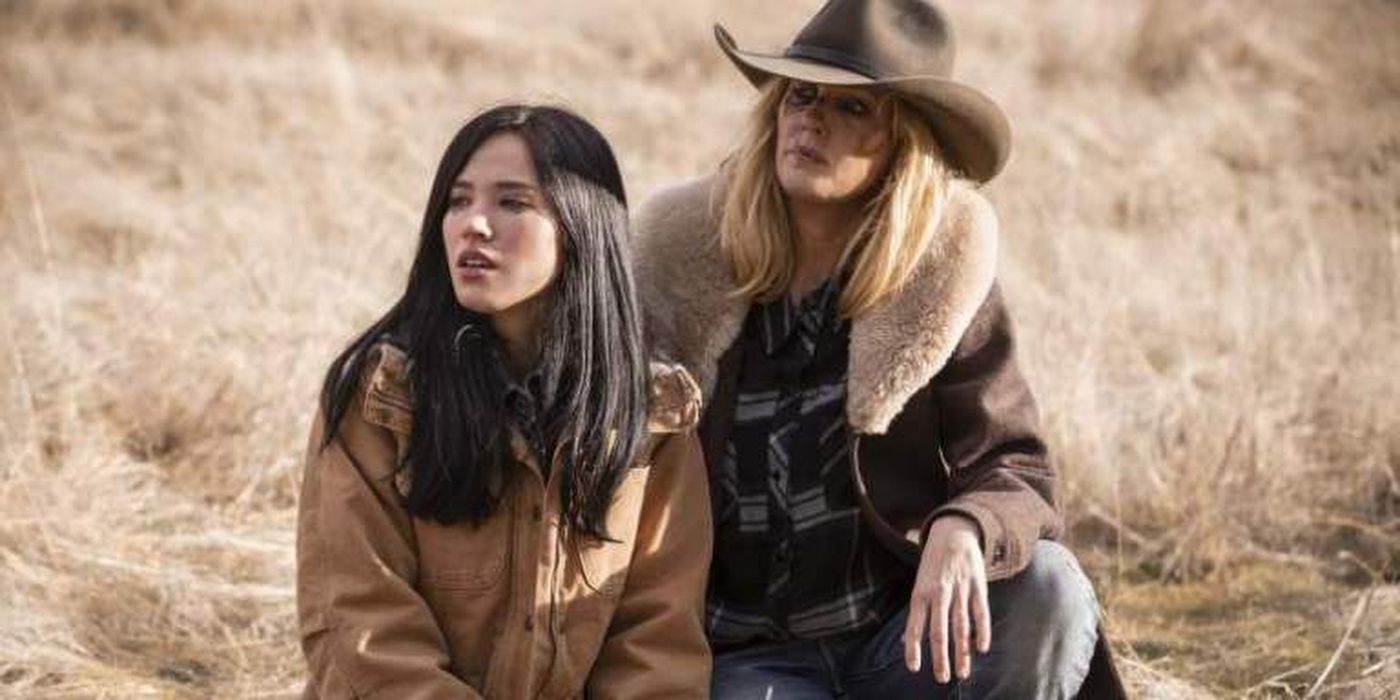 Beth (Kelly Reilly) and Monica (Kelsey Asbille) kneeling next to each other in Yellowstone
