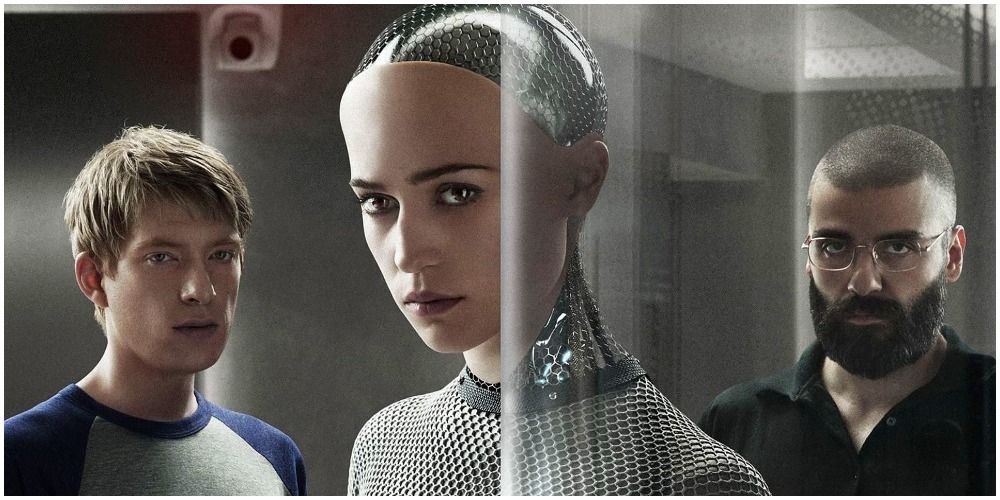 Two Men And Female Robot Looking Into The Camera