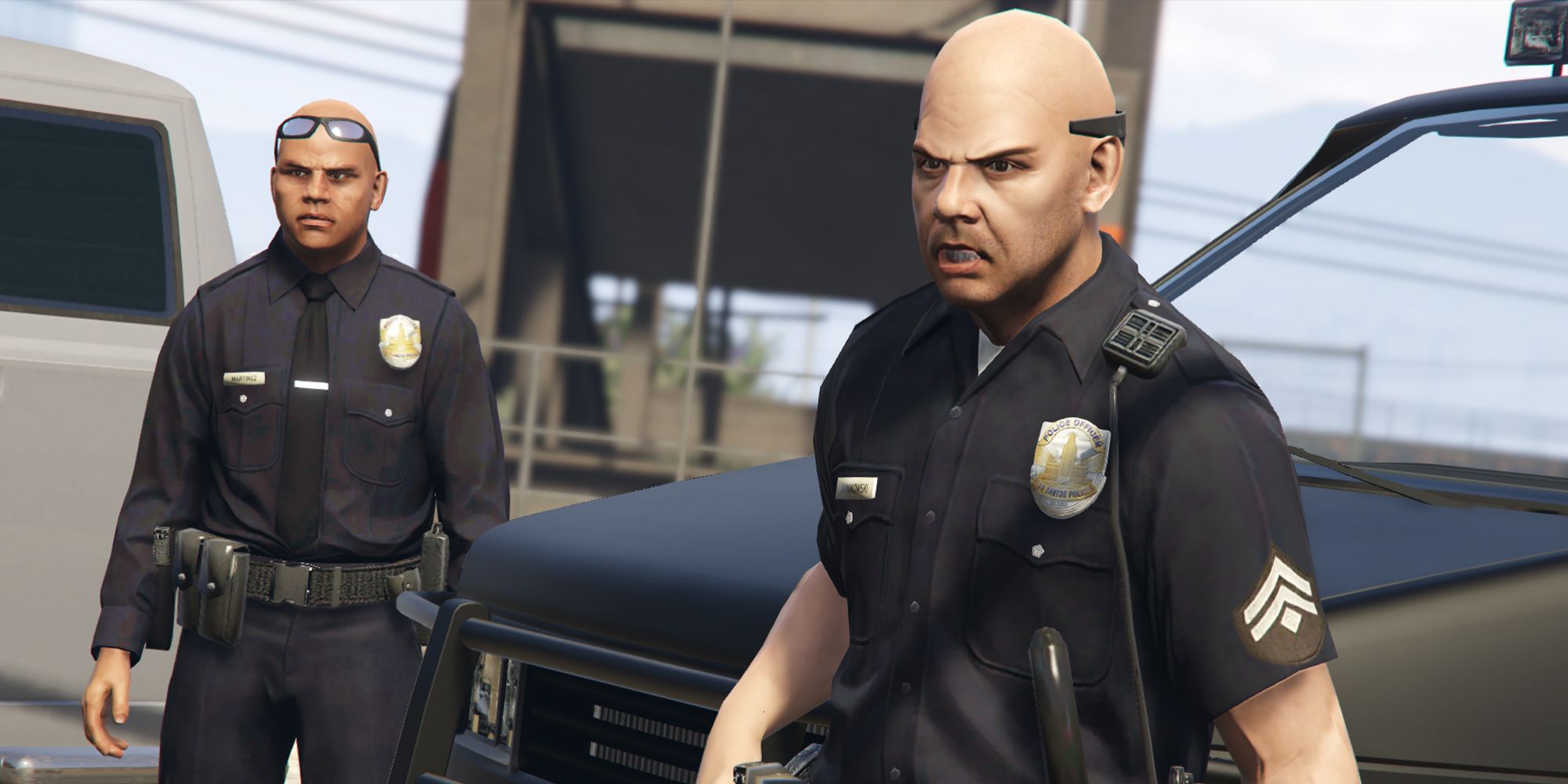Two police officers in GTA Online staring angrily into the camera