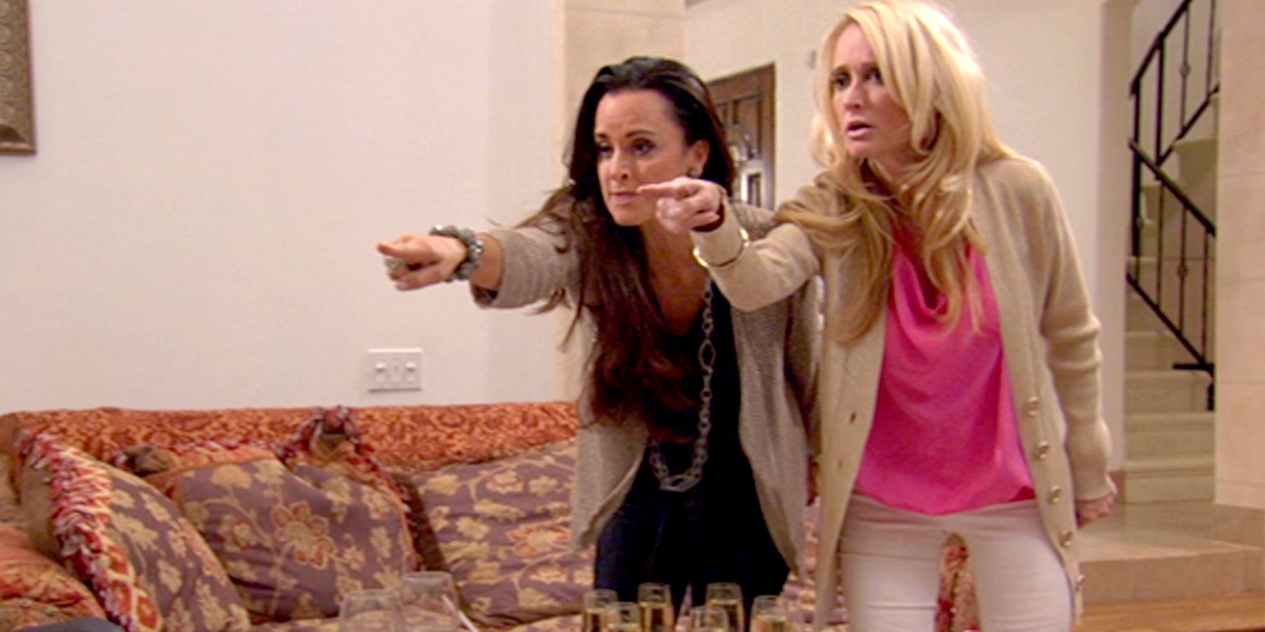 Kim and Kyle pointing at Brandi in an episode of RHOBH