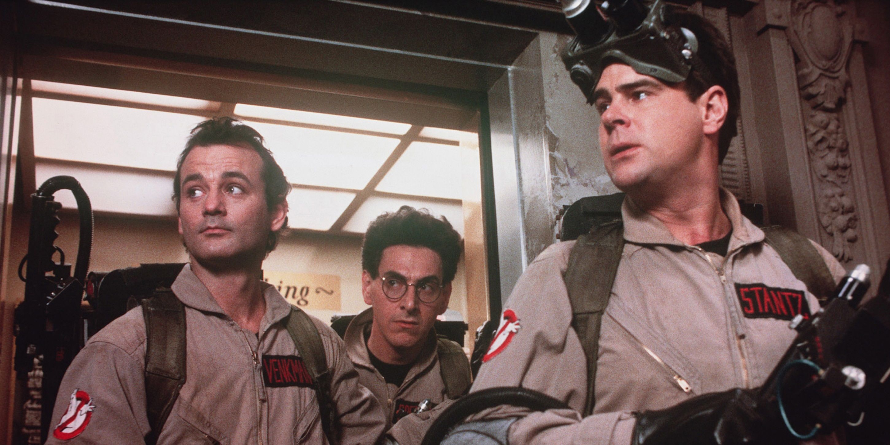 The Ghostbusters emerging from an elevator