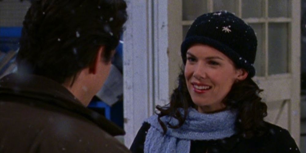 Max and Lorelai standing in the snow in Stars Hollow on Gilmore Girls