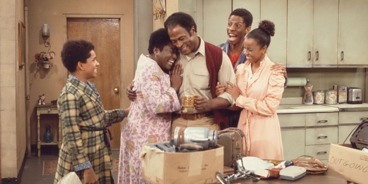 James Evans, Sr. and Florida in Good Times in the kitchen with the kids, all are looking happy.