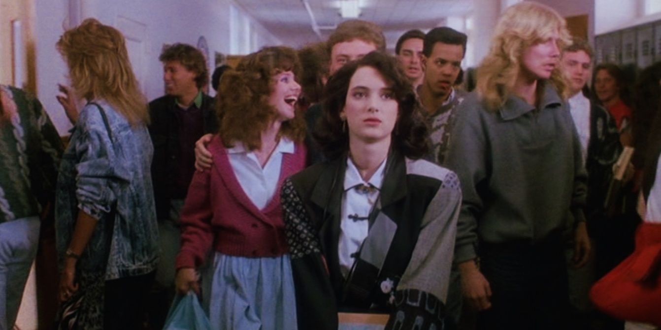 a group of teens in a crowded high school hallway