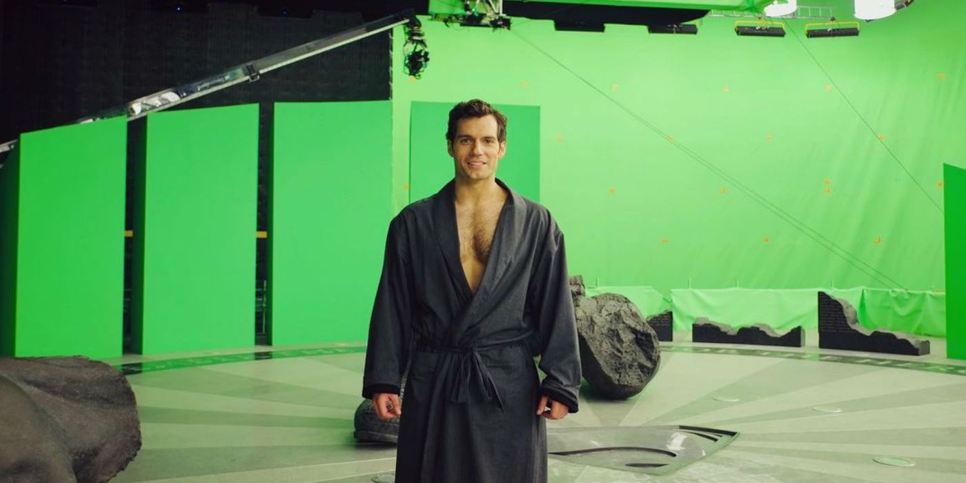 Henry Cavill smiling and standing in front of a green screen in Zack Snyder's Justice League