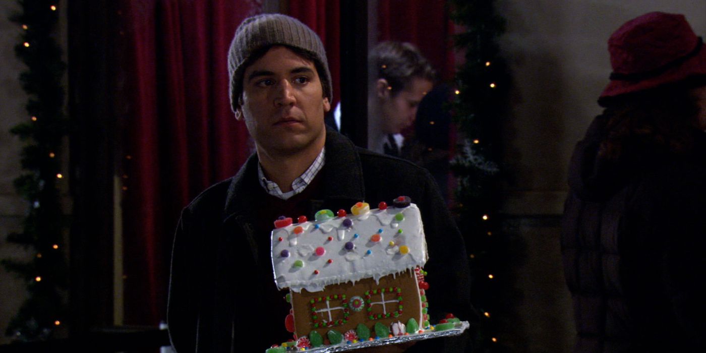 Ted holding a gingerbread house in How I Met Your Mother