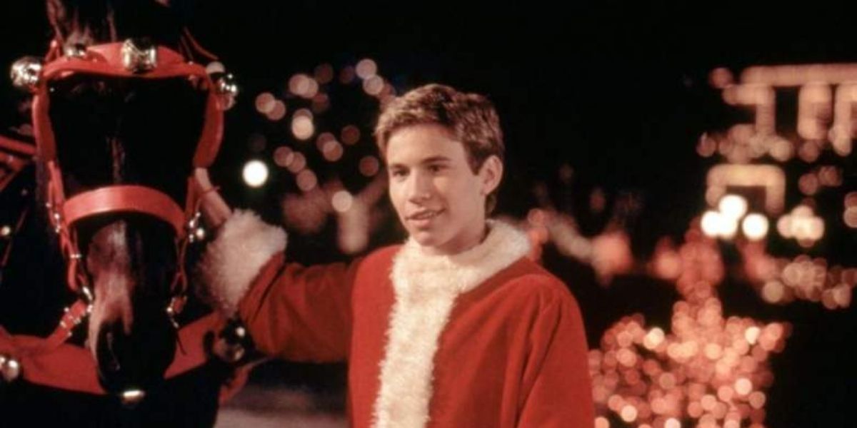 Jonathan Taylor Thomas petting his horse in I&rsquo;ll Be Home For Christmas