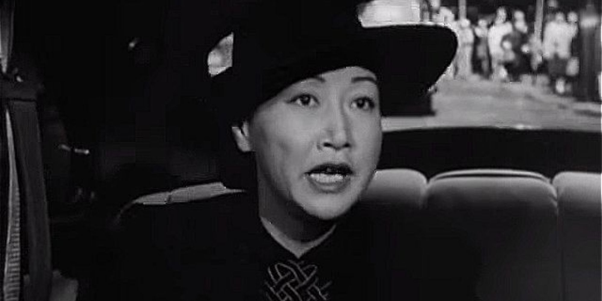 A screenshot of Anna May Wong as the housekeeper Su Lin in Impact (1949)