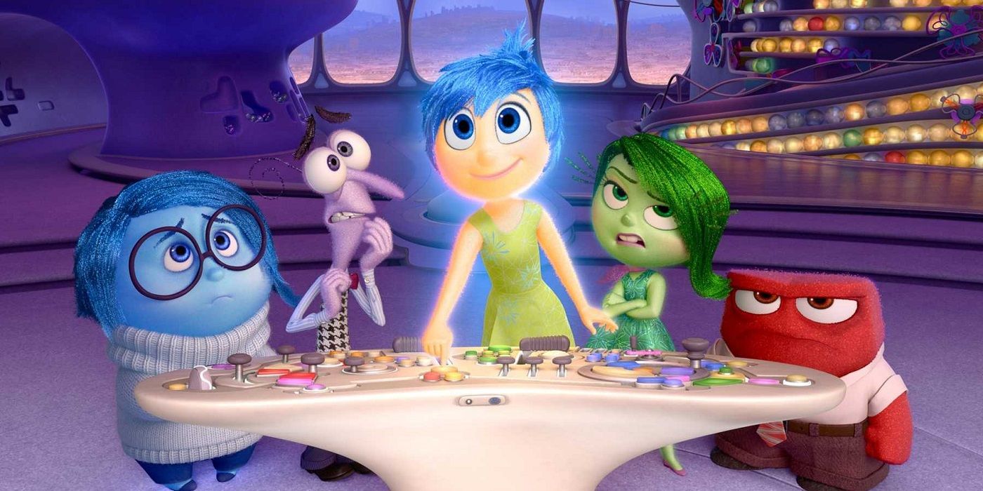 The emotions stand around the controls of Riley’s mind in Inside Out