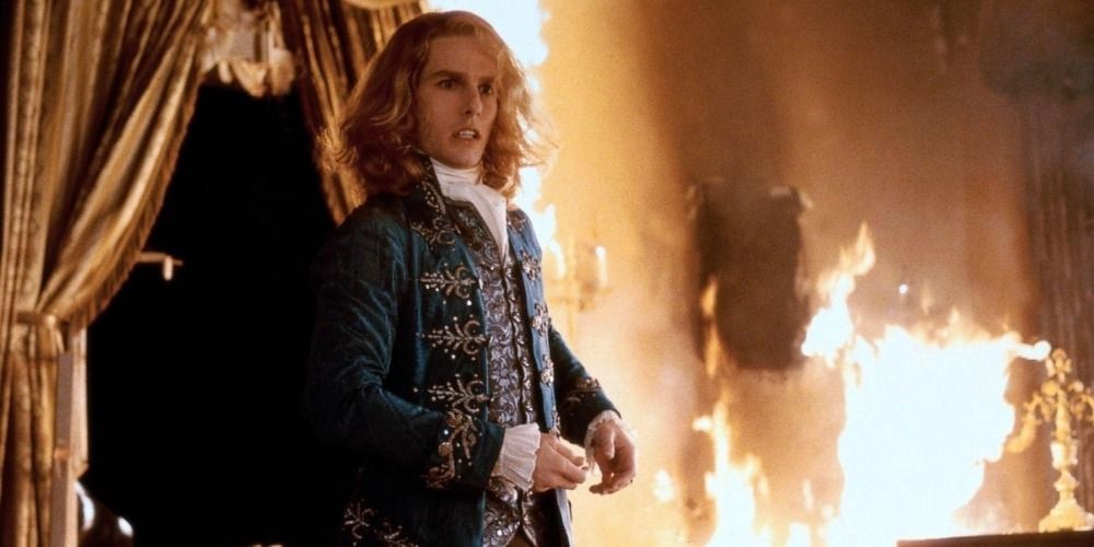 Lestat standing in a burning house in Interview With A Vampire (1994)
