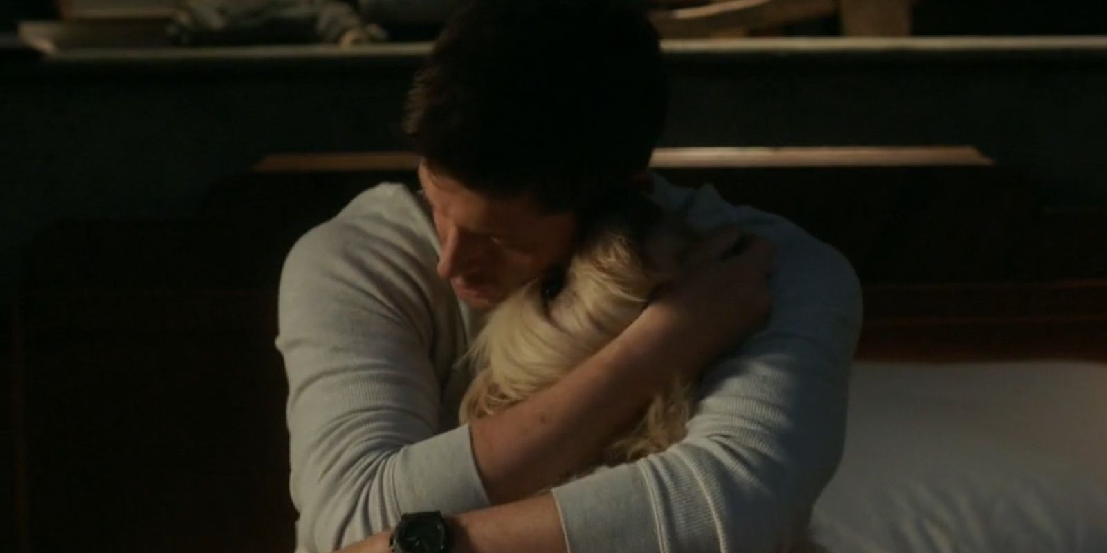 Dean hugs Miracle the dog