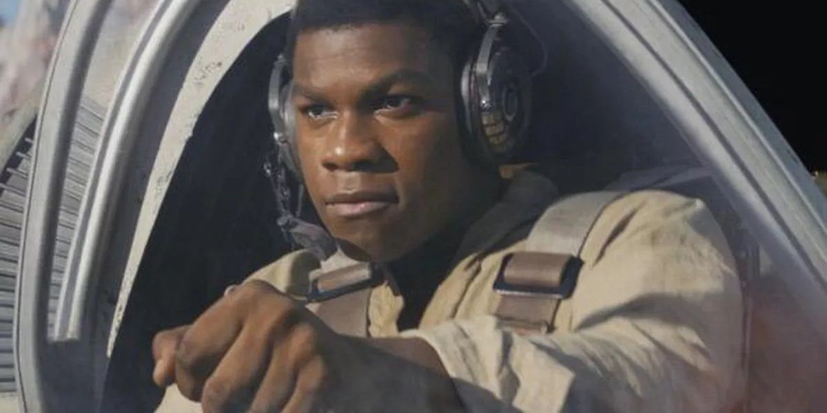 John Boyega as Finn piloting a ship in Star Wars The Last Jedi