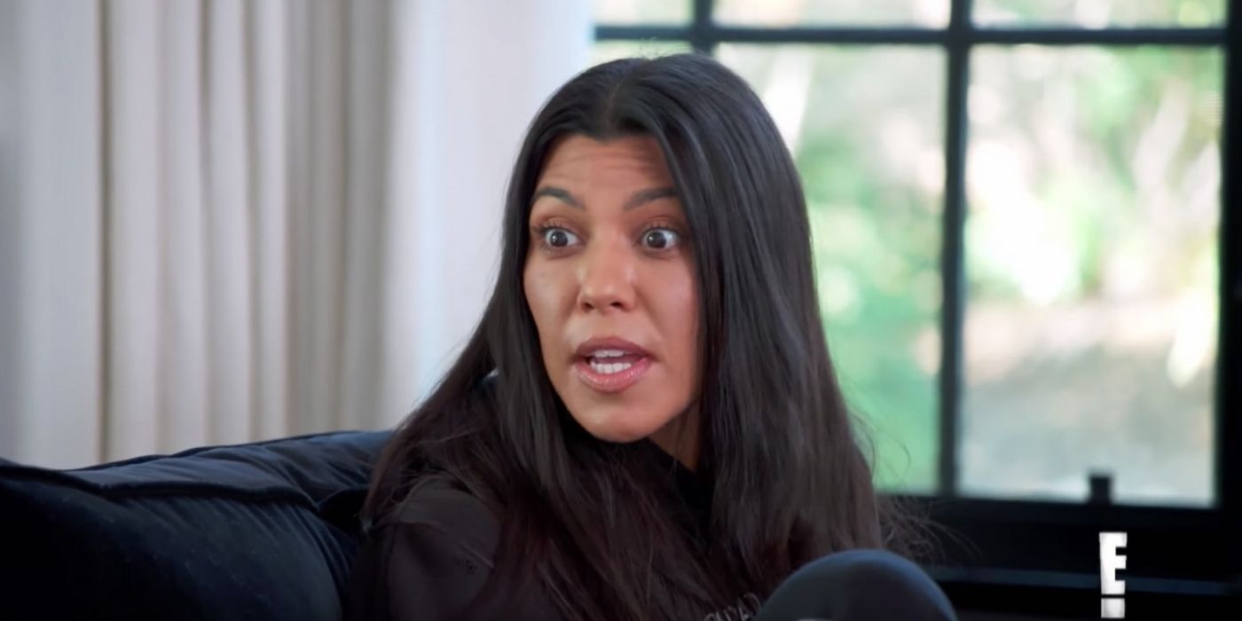 Kourtney Kardashian in Keeping Up With The Kardashians talking in black turtleneck