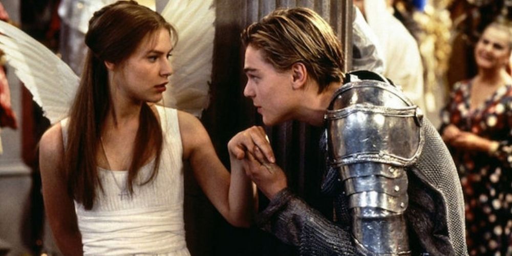 Leonardo Dicaprio wearing a Knight costume kissing Clare Danes' hand in Romeo and Juliet