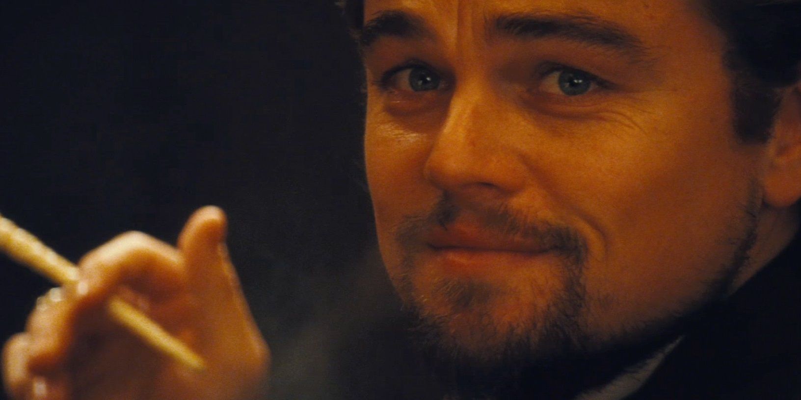 Leonardo DiCaprio smiling in Django Unchained