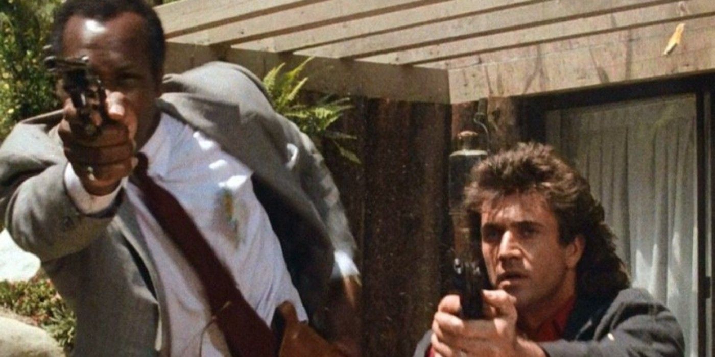 Riggs and Murtaugh point guns in Lethal Weapon