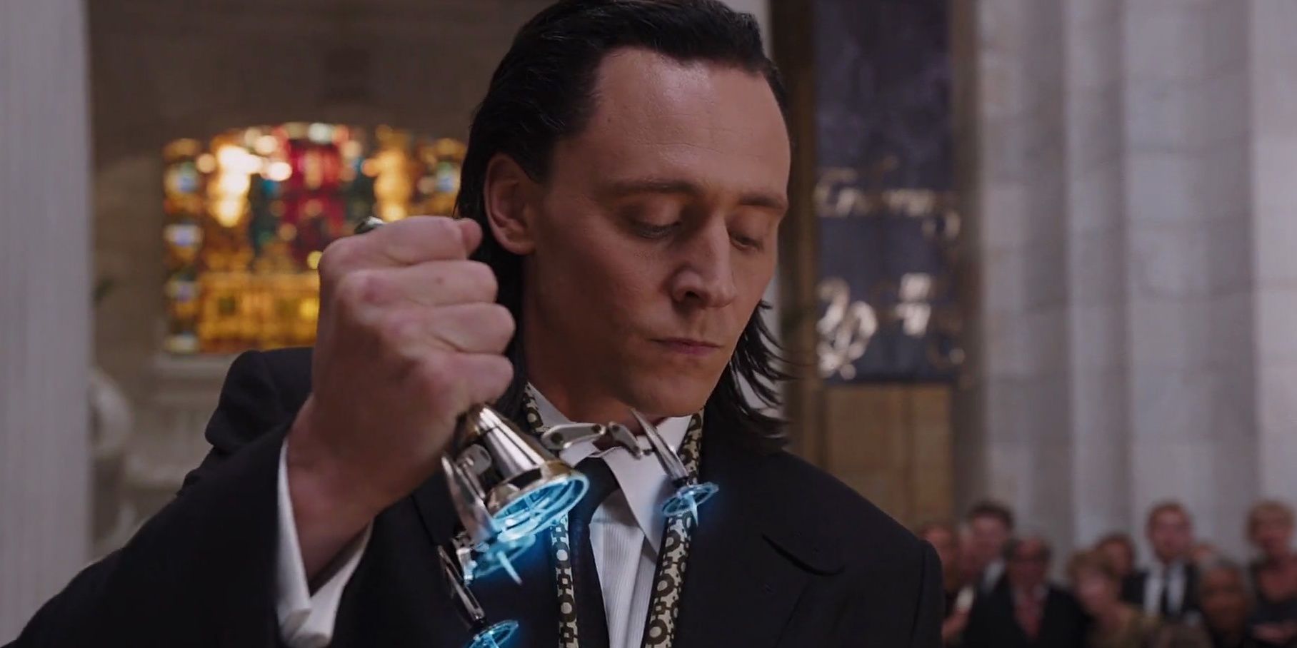 Loki takes the eyeball off of a man in The Avengers