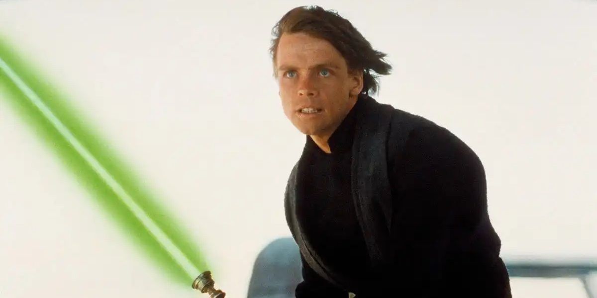 Luke Skywalker holding his new green lightsaber in Return of the Jedi