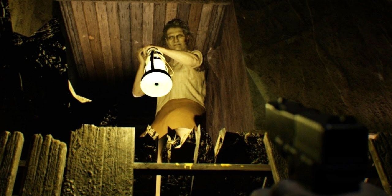 Marguerite Baker stands holding a lantern in Resident Evil 7