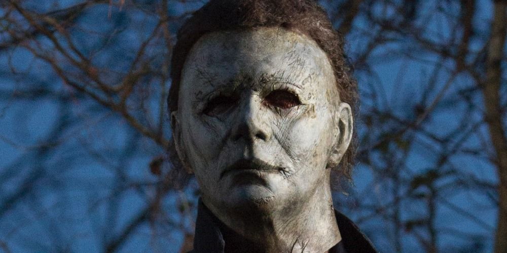 Michael Myers stands in the middle of the street in Halloween 2018