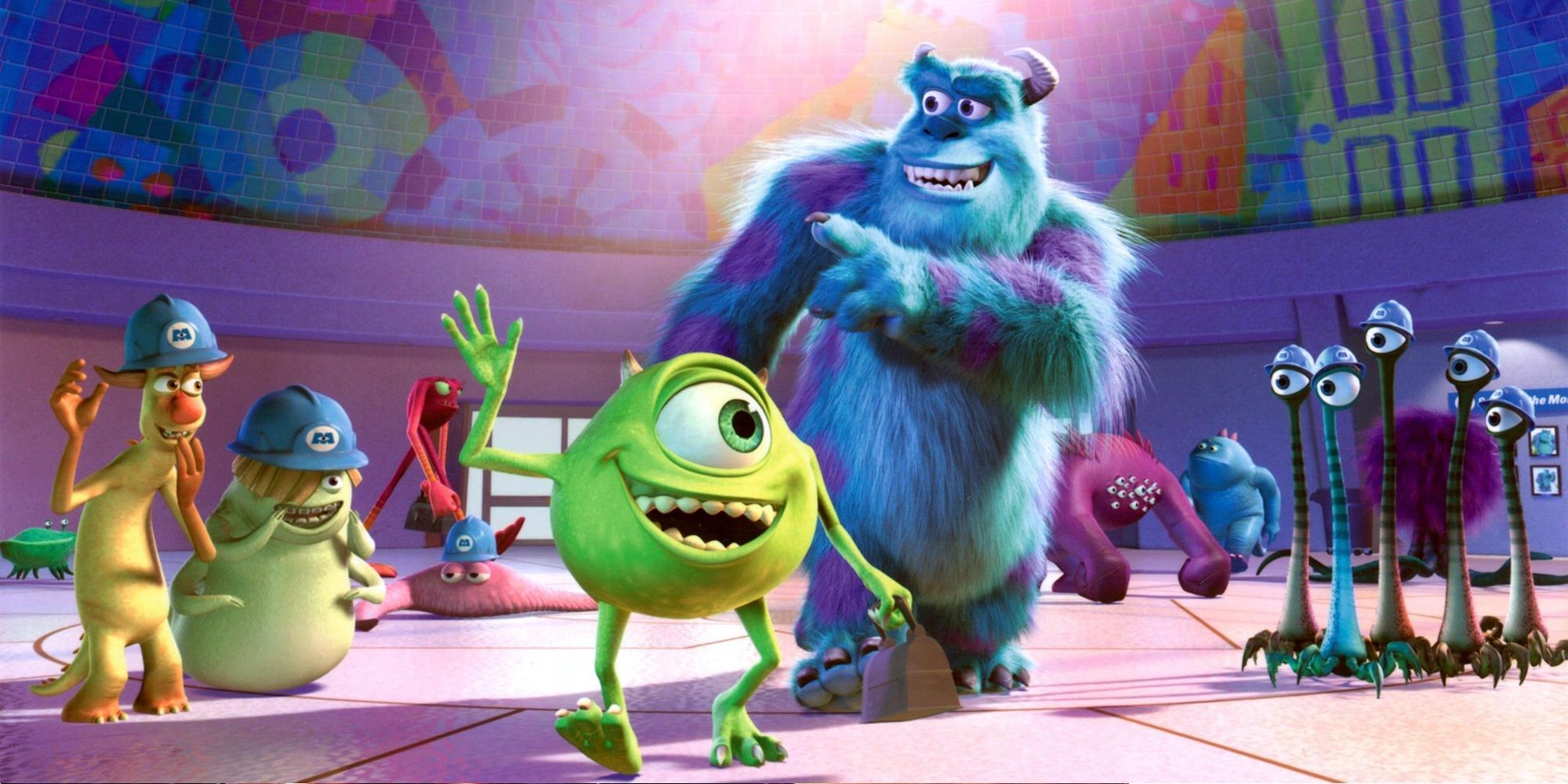 Mike and Sulley surrounded by other monster workers in Monsters Inc