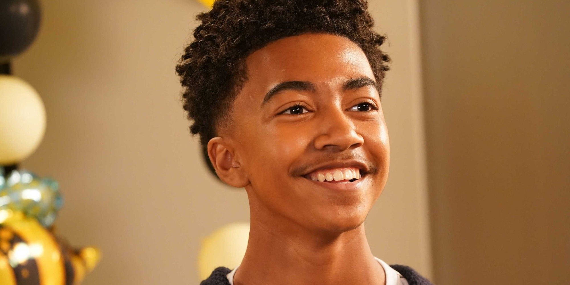 Miles Brown smiles in black-ish.