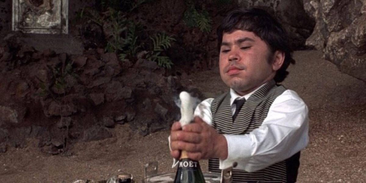 Nick Nack opening some champagne in The Man with the Golden Gun