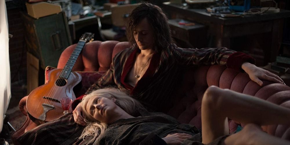 Tilda Swinton laying on Tom Hiddleston's lap in Only Lovers Left Alive