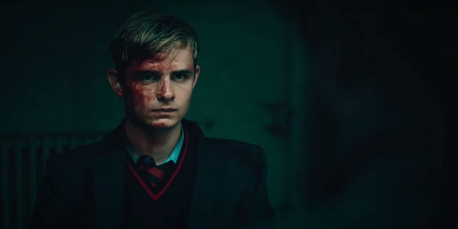Alex Rider with his face half-covered in blood in Alex Rider.