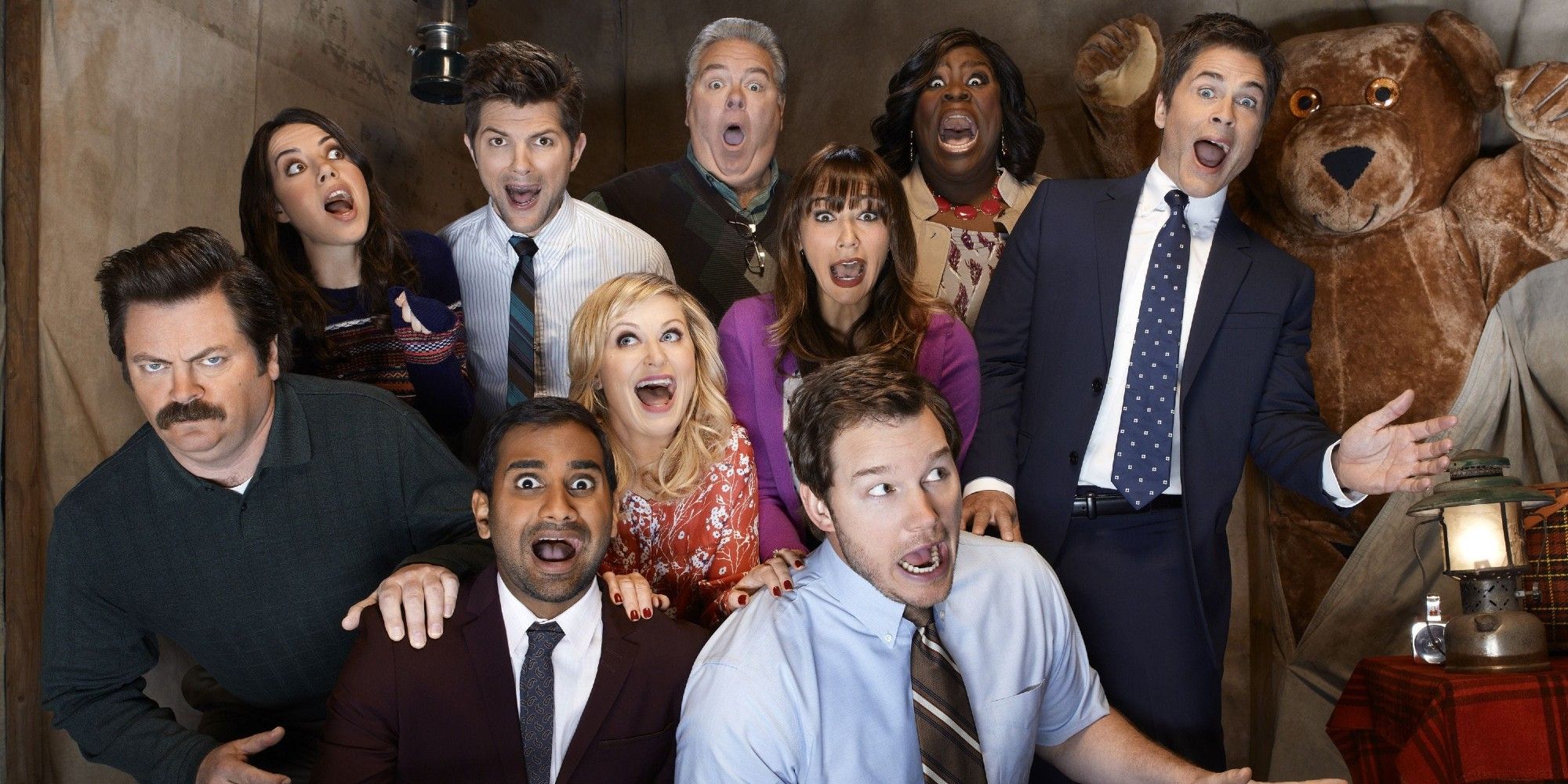 The Parks and Recreation cast huddled up together