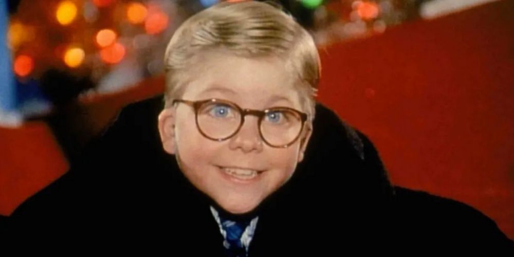 Peter Billingsley as Ralphie in A Christmas Story, smiling while looking up.